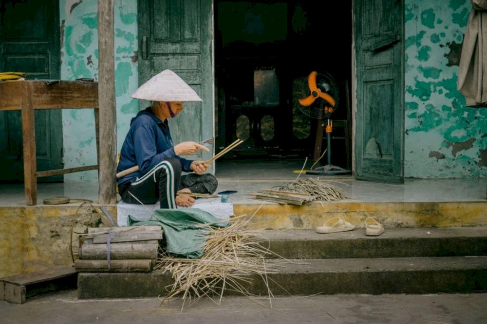 A local artisan carefully hand-carved bamboo
